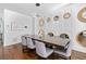 Elegant dining room with hardwood floors and a modern light fixture offers a sophisticated space at 160 Vanira Se Ave # A, Atlanta, GA 30315