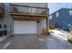 Garage with white door beneath a deck, showcasing additional outdoor living space at 160 Vanira Se Ave # A, Atlanta, GA 30315