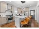 Bright kitchen features stainless appliances, white backsplash and countertops and modern lighting at 160 Vanira Se Ave # A, Atlanta, GA 30315