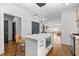 Bright kitchen features stainless appliances, white backsplash and countertops and island with microwave at 160 Vanira Se Ave # A, Atlanta, GA 30315