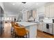 Bright kitchen features stainless appliances, white cabinetry and island with seating for three at 160 Vanira Se Ave # A, Atlanta, GA 30315