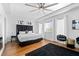 Spacious main bedroom boasts natural light, wood floors, a ceiling fan and stylish black accents at 160 Vanira Se Ave # A, Atlanta, GA 30315