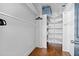 Walk-in closet features custom shelves and hanging rods for optimal organization at 160 Vanira Se Ave # A, Atlanta, GA 30315