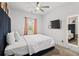 Bedroom with queen bed, full-length mirror, and ceiling fan at 160 Vanira Se Ave # A, Atlanta, GA 30315