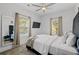 Bright bedroom with a queen bed and ceiling fan at 160 Vanira Se Ave # A, Atlanta, GA 30315