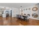 Modern dining room with large table, gray chairs, and statement wall at 160 Vanira Se Ave # A, Atlanta, GA 30315