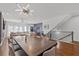 Long dining table with gray chairs and modern chandelier at 160 Vanira Se Ave # A, Atlanta, GA 30315