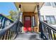 Red front door with gray siding and wooden accents at 160 Vanira Se Ave # A, Atlanta, GA 30315