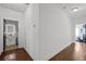 Bright hallway with hardwood floors and access to bedrooms and bathroom at 160 Vanira Se Ave # A, Atlanta, GA 30315