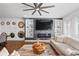 Living room with stone fireplace, built-in shelving, and hardwood floors at 160 Vanira Se Ave # A, Atlanta, GA 30315