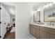 Elegant bathroom with double vanity, marble countertops, and gold fixtures at 380 Atwood Nw Dr, Marietta, GA 30064