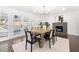 Bright dining room with hardwood floors and a modern fireplace at 380 Atwood Nw Dr, Marietta, GA 30064