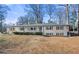 Updated ranch home with gray roof and white exterior, situated on a spacious lot at 380 Atwood Nw Dr, Marietta, GA 30064