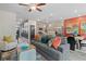 Open living space with gray sofa and colorful decor at 447 Payne Dr, Mcdonough, GA 30294