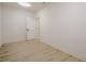 Simple, bright basement bedroom with light wood floors at 4840 Northway Dr, Atlanta, GA 30342