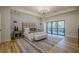 Main bedroom with hardwood floors, tray ceiling and access to balcony at 4840 Northway Dr, Atlanta, GA 30342