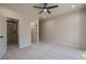 Bedroom with carpet, ceiling fan, and en-suite bathroom at 4840 Northway Dr, Atlanta, GA 30342