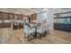 Dining area with glass table and white chairs near kitchen at 4840 Northway Dr, Atlanta, GA 30342