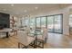 Bright dining area with glass table and white chairs near sliding doors at 4840 Northway Dr, Atlanta, GA 30342