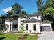 Modern two-story home with white brick and a gray roof at 4840 Northway Dr, Atlanta, GA 30342