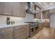 Modern kitchen with stainless steel appliances and light wood cabinets at 4840 Northway Dr, Atlanta, GA 30342