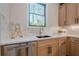 Kitchen corner with quartz countertops and stainless steel dishwasher at 4840 Northway Dr, Atlanta, GA 30342