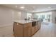 Kitchen island with white quartz countertop and light wood cabinets at 4840 Northway Dr, Atlanta, GA 30342