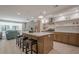 Modern kitchen with light wood cabinets, quartz countertops, and island with seating at 4840 Northway Dr, Atlanta, GA 30342