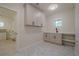 Convenient laundry room with upper cabinets and a built-in sink at 4840 Northway Dr, Atlanta, GA 30342