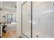 Large walk-in shower with marble tile and frameless door at 4840 Northway Dr, Atlanta, GA 30342