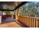 Spacious back porch with wooden railings and seating area at 5035 Villa Rica Hwy, Dallas, GA 30157