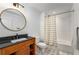 Clean bathroom with a shower/tub combo, updated vanity, and a stylish mirror at 5035 Villa Rica Hwy, Dallas, GA 30157