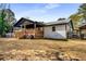 White house with black roof, wooden deck, and backyard at 5035 Villa Rica Hwy, Dallas, GA 30157