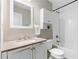 Updated bathroom with white vanity, subway tile and bathtub shower at 698 Rochelle Sw Dr, Atlanta, GA 30310