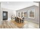 Bright dining room with hardwood floors and a large dining table at 698 Rochelle Sw Dr, Atlanta, GA 30310