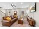 Living room with leather sofa, hardwood floors and ceiling fan at 698 Rochelle Sw Dr, Atlanta, GA 30310