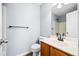 Clean bathroom with vanity, toilet and shower, with wood-look floors at 900 Tree Creek Blvd, Lawrenceville, GA 30043