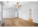 Large bedroom with wood-look floors, double doors to closet and access to bathroom at 900 Tree Creek Blvd, Lawrenceville, GA 30043