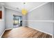 Dining room with hardwood floors and sliding glass doors to patio at 900 Tree Creek Blvd, Lawrenceville, GA 30043