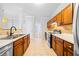 Updated kitchen featuring wood cabinets and a tile backsplash at 900 Tree Creek Blvd, Lawrenceville, GA 30043