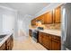 Bright kitchen with stainless steel appliances and wood cabinets at 900 Tree Creek Blvd, Lawrenceville, GA 30043