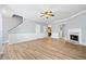 Bright living room featuring hardwood floors and a fireplace at 900 Tree Creek Blvd, Lawrenceville, GA 30043