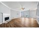 Living room with hardwood floors, fireplace and ceiling fan at 900 Tree Creek Blvd, Lawrenceville, GA 30043