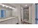 Double vanity bathroom with granite countertops and a shower at 18 Loth Wages (Lot 18) Rd, Dacula, GA 30019