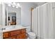 Neat bathroom with a toilet, sink, and shower/tub combo at 1806 Adagio Dr, Alpharetta, GA 30009