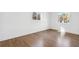 Well-lit bedroom featuring hardwood floors and two windows at 2359 Melinda Ne Dr, Atlanta, GA 30345