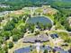 Aerial view of a park featuring baseball fields, a pond, playgrounds, and an activity building at 2808 Lillian Ln, Douglasville, GA 30135