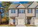 Charming townhome exterior with gray siding, black shutters, and attached garage at 2808 Lillian Ln, Douglasville, GA 30135