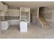 Unfinished kitchen with white cabinets near the stairs ready to be customized to your taste at 2808 Lillian Ln, Douglasville, GA 30135