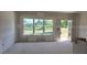 Spacious living room with large windows and natural light is awaiting your finishing touches at 2808 Lillian Ln, Douglasville, GA 30135
